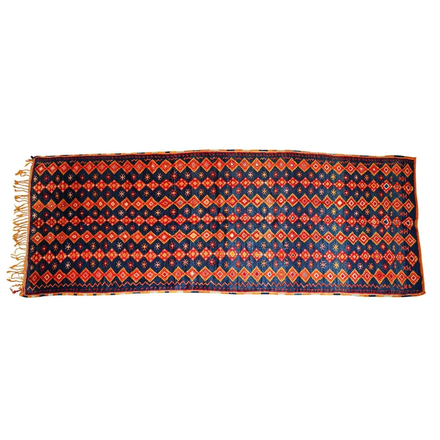 Woven rug with orange and blue pattern on a white background